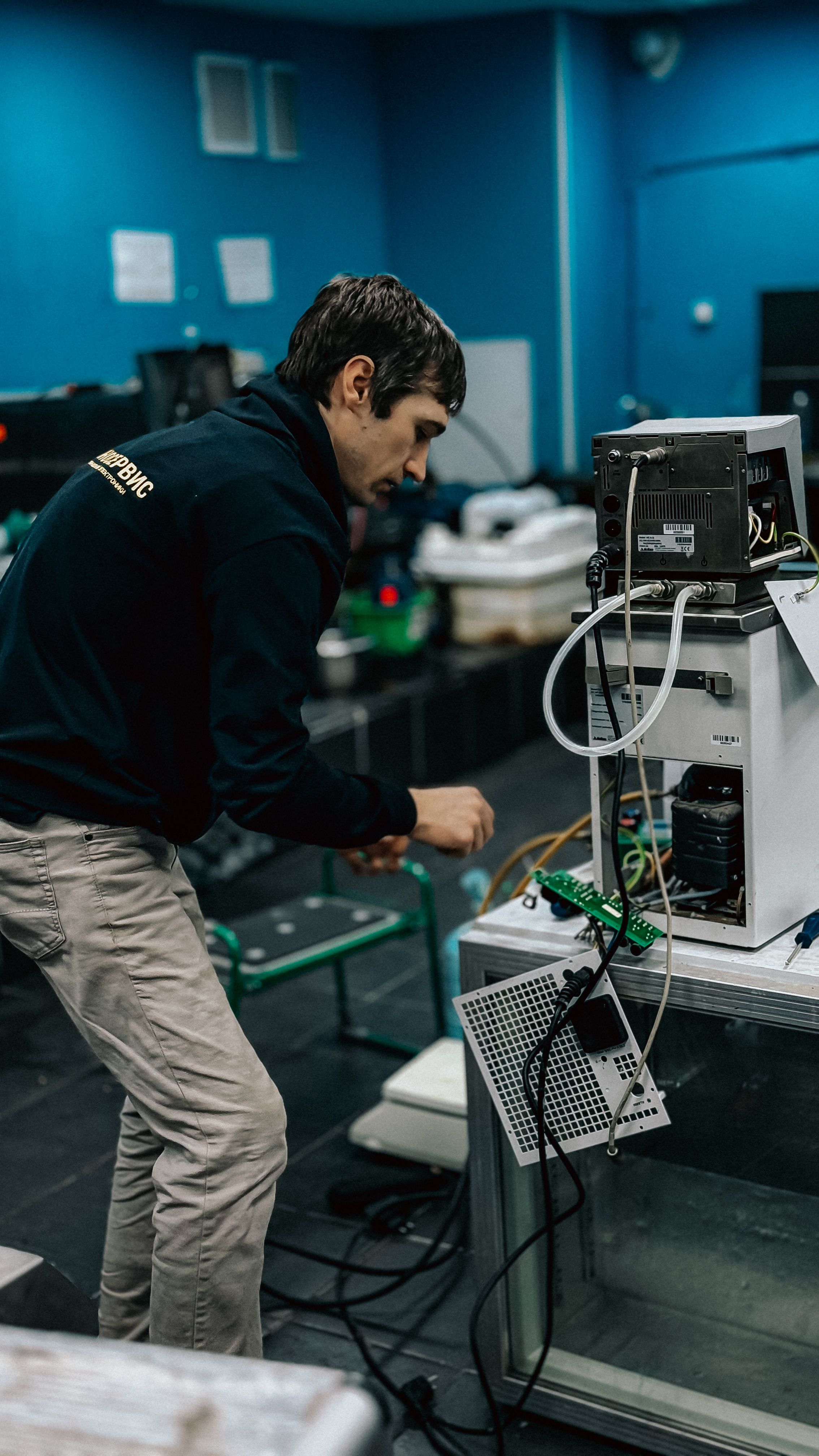 Biomedical engineer supporting hospital equipment